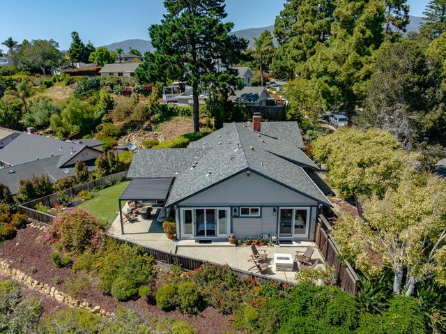 an aerial view of a house with swimming pool
