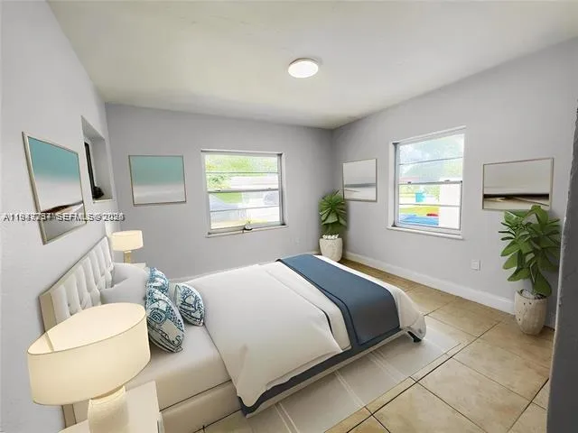 a bedroom with a bed and a couch