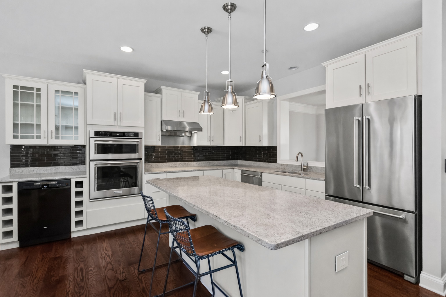 311 South NW Highway, Unit 1 Park Ridge, IL 60068 - Photo 4 of 30 a kitchen with kitchen island a refrigerator a stove a sink and a oven