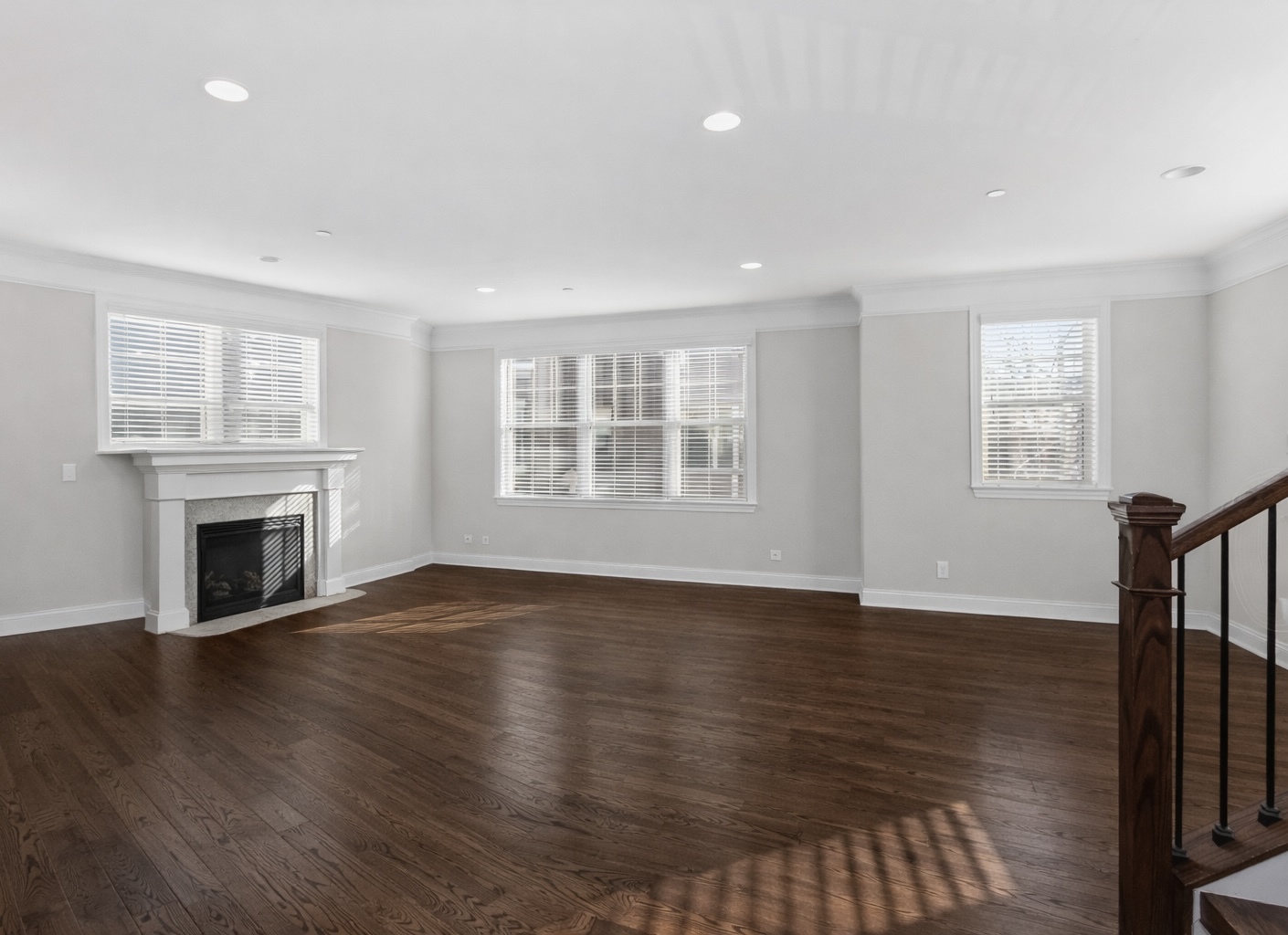 311 South NW Highway, Unit 1 Park Ridge, IL 60068 - Photo 9 of 30 an empty room with wooden floor fireplace and windows