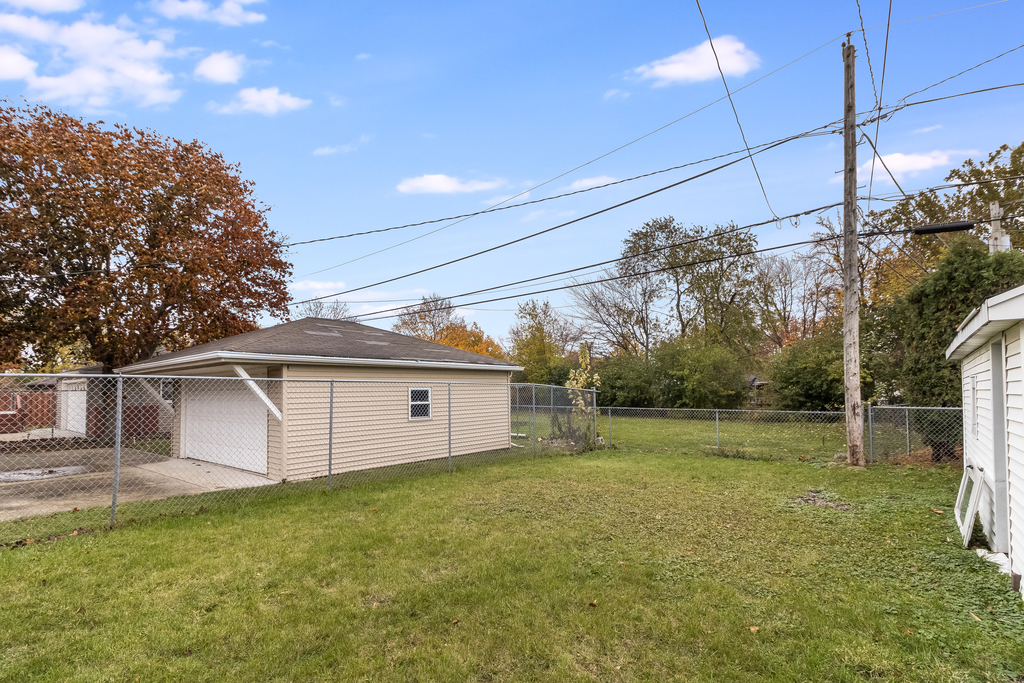 466 East Butterfield Road Elmhurst, IL 60126 - Photo 11 of 11 a view of a backyard with potted plants and large trees
