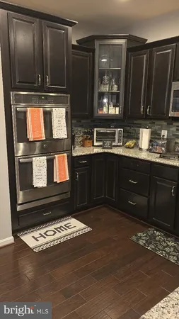 a kitchen with wooden cabinets and a sink