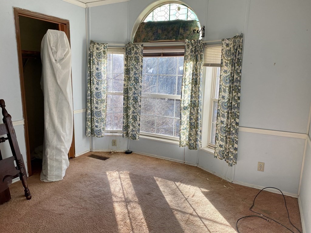 390 Patriots Road Templeton, MA 01468 - Photo 11 of 21 a view of livingroom with window and hallway