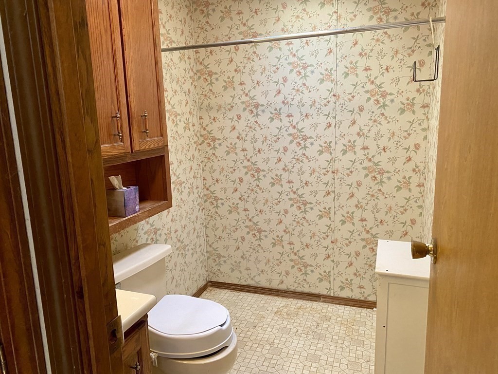 390 Patriots Road Templeton, MA 01468 - Photo 12 of 21 a bathroom with a toilet and a shower curtain