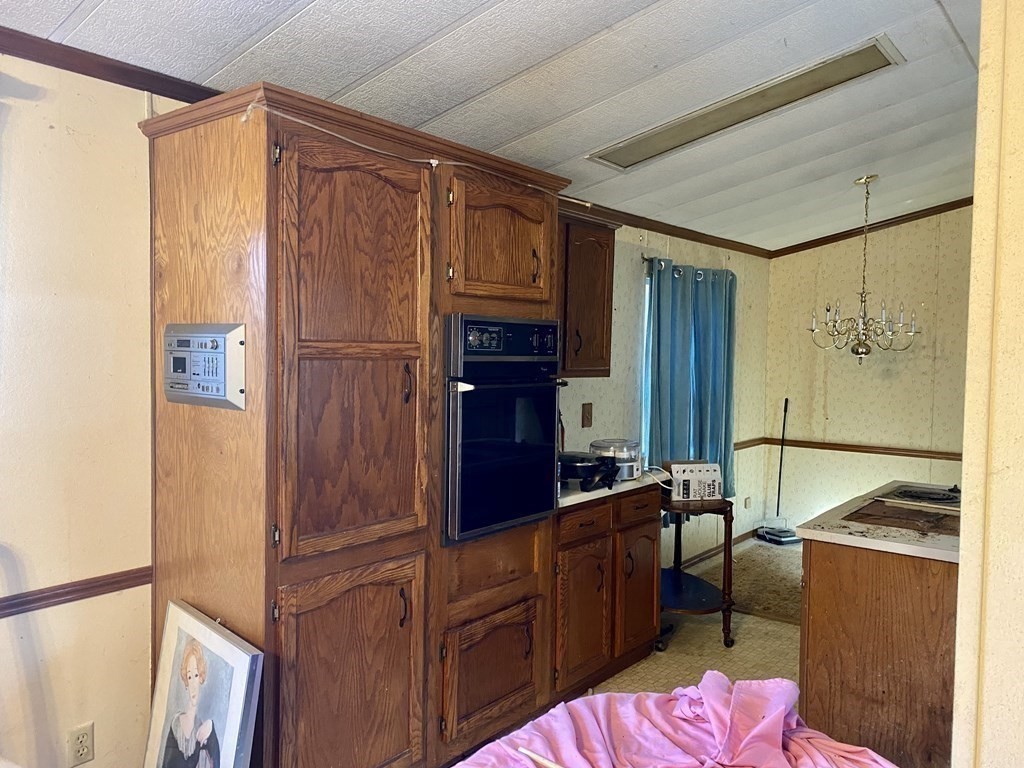 390 Patriots Road Templeton, MA 01468 - Photo 5 of 21 a kitchen with cabinets and refrigerator