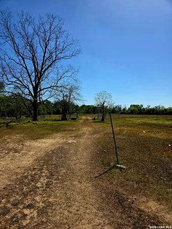a view of a lake with a yard