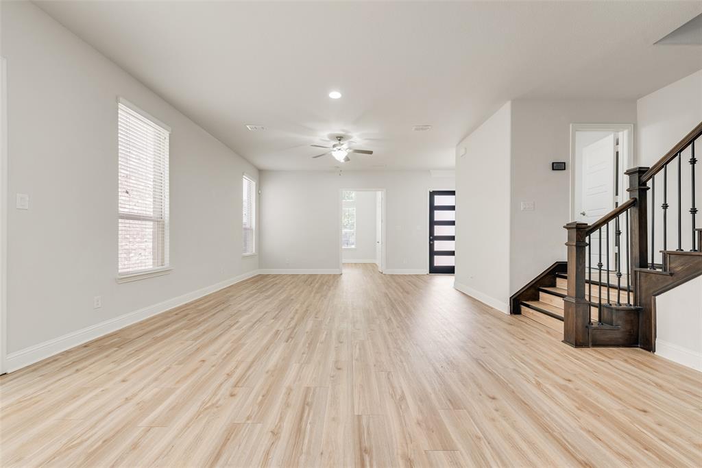 628 Ansley Way Allen, TX 75013 - Photo 3 of 20 Spacious living area featuring light wood-finish flooring, recessed lighting, and a ceiling fan