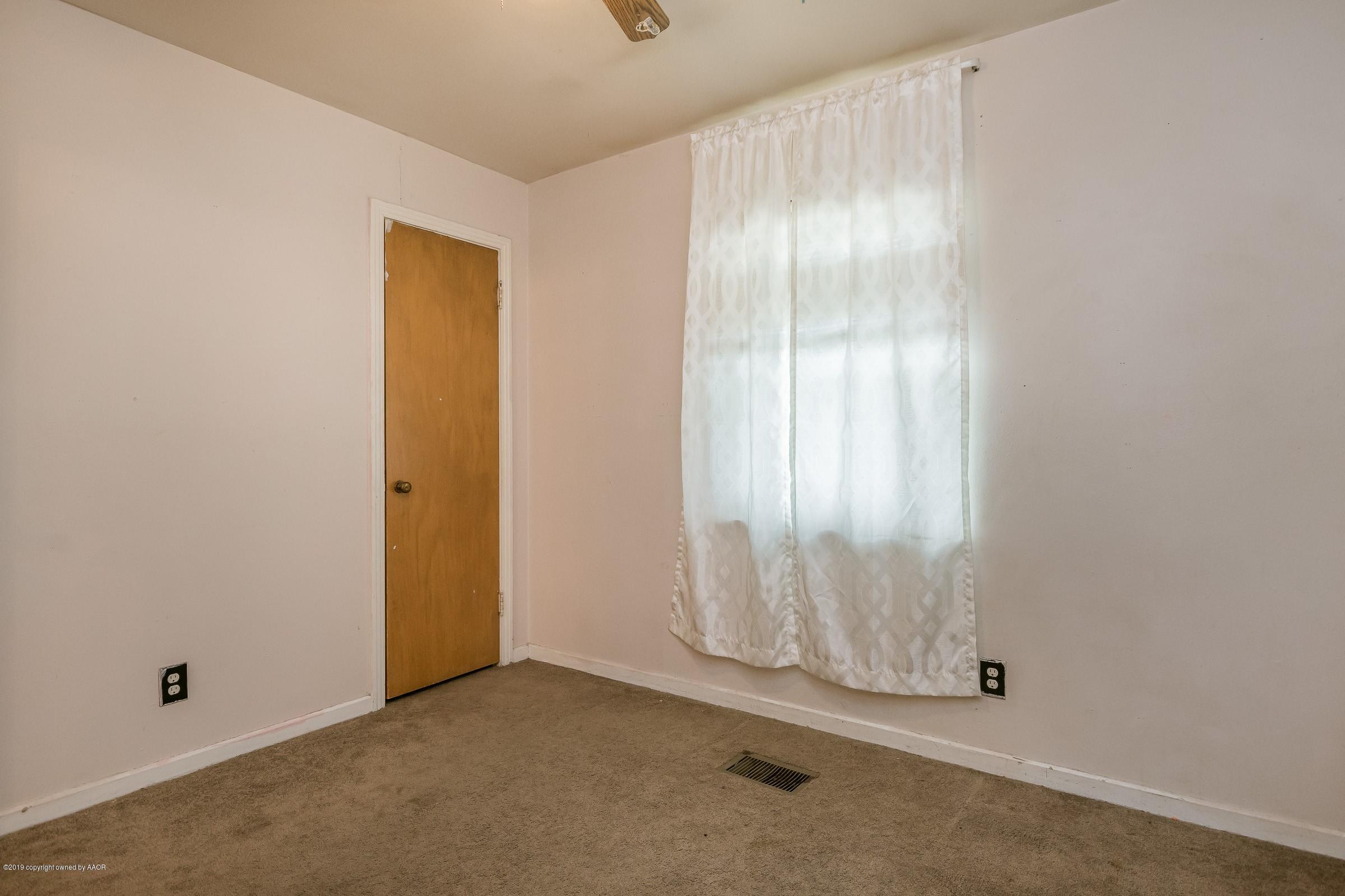 4318 Cline Road Amarillo, TX 79110 - Photo 14 of 21 a view of an empty room with a window