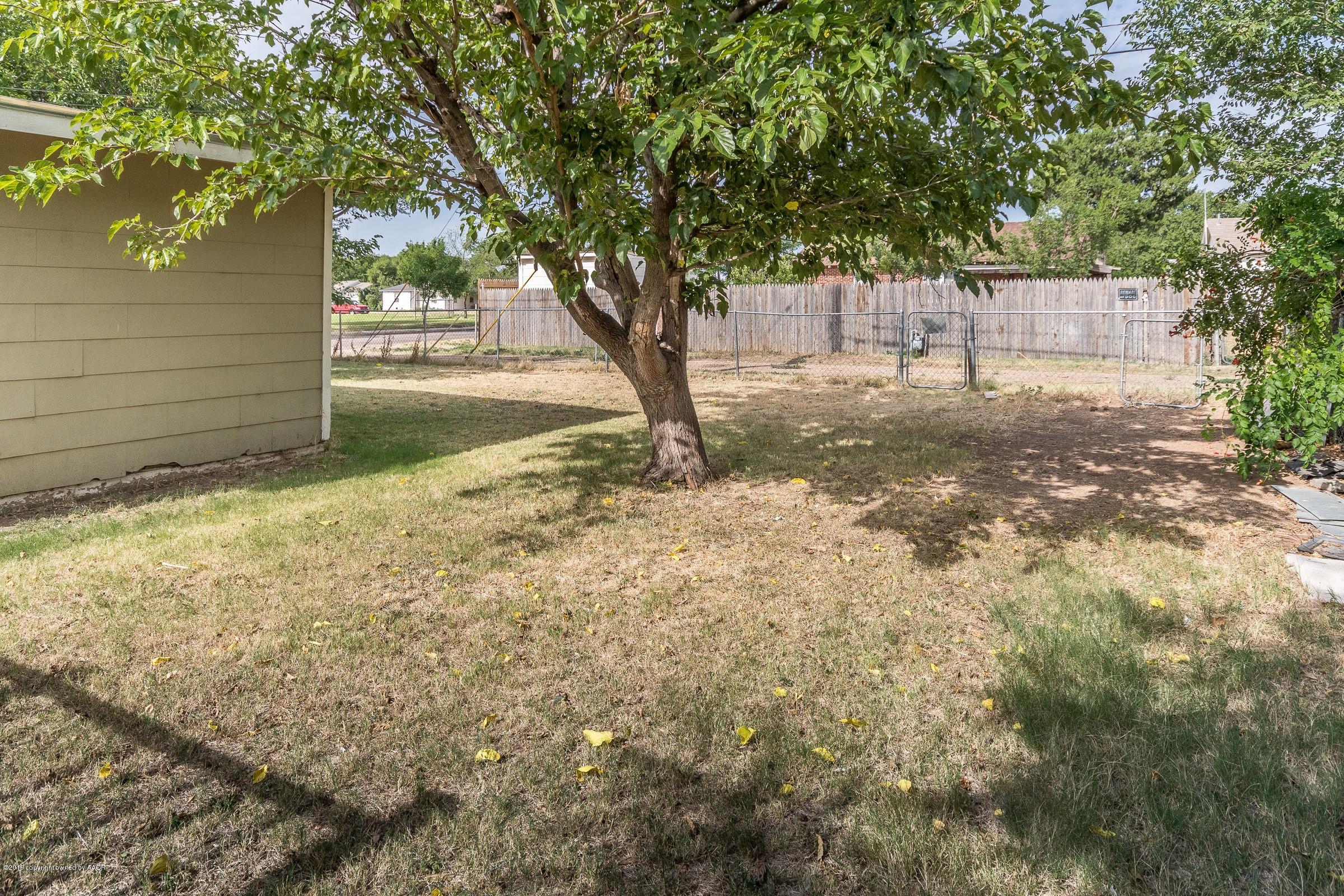 4318 Cline Road Amarillo, TX 79110 - Photo 18 of 21 a view of backyard with tree