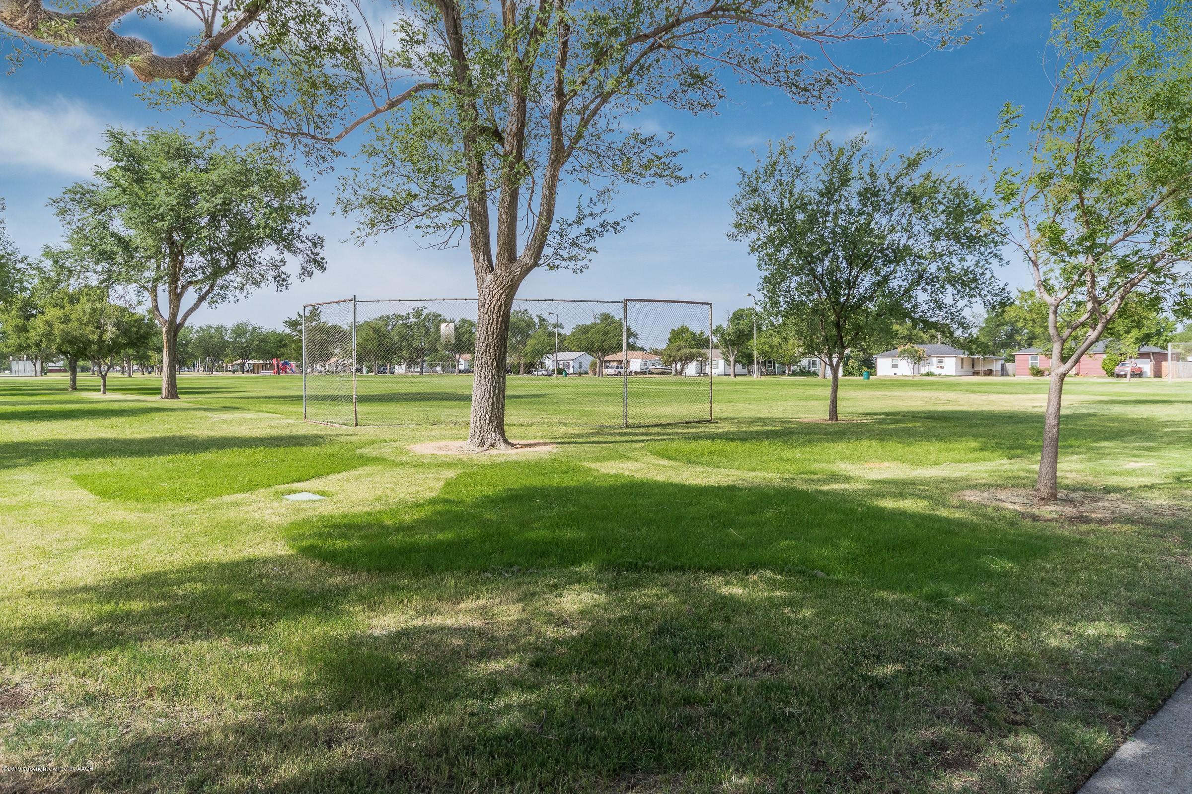 4318 Cline Road Amarillo, TX 79110 - Photo 21 of 21 a view of a big yard with a trees