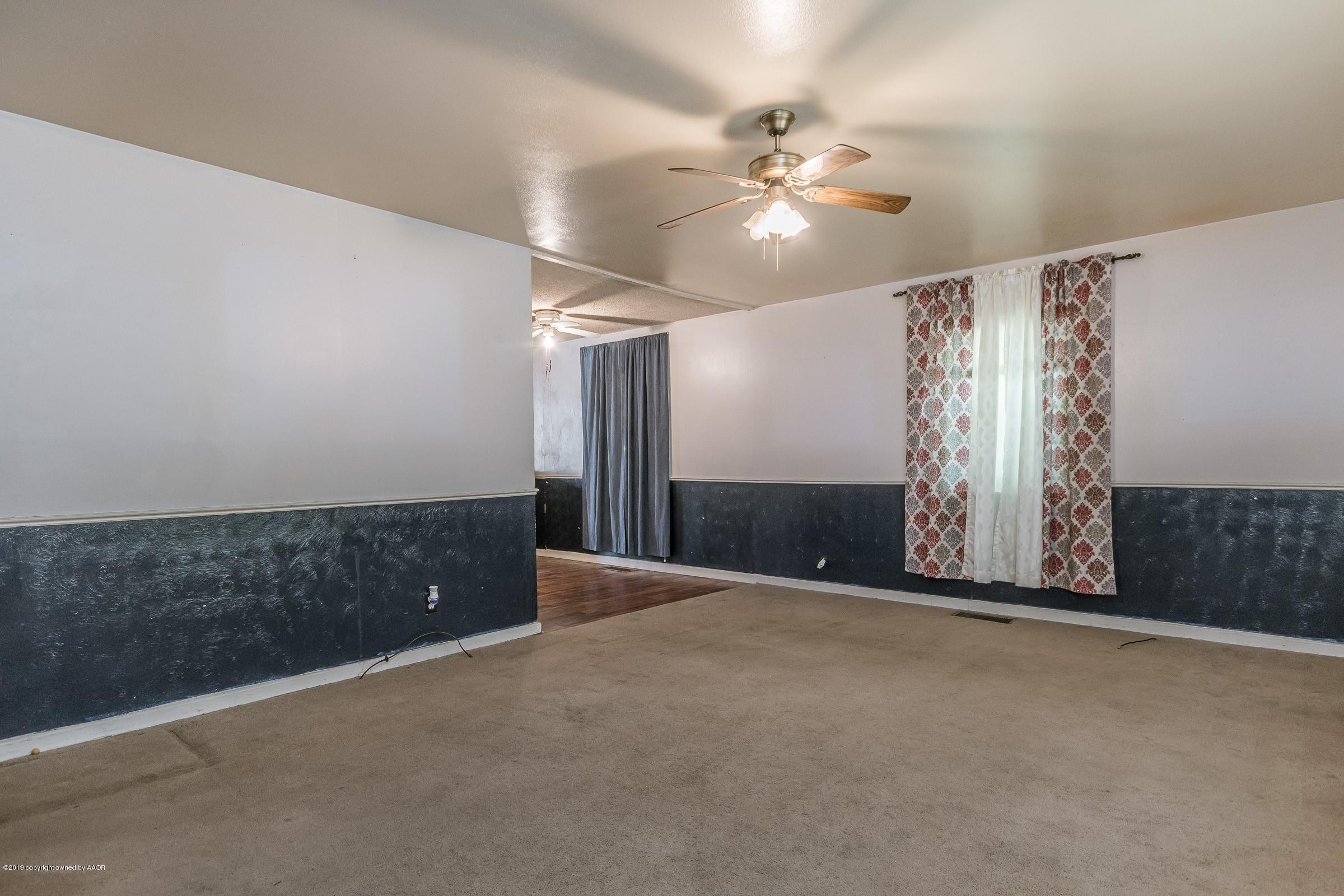 4318 Cline Road Amarillo, TX 79110 - Photo 3 of 21 an empty room with fan and windows