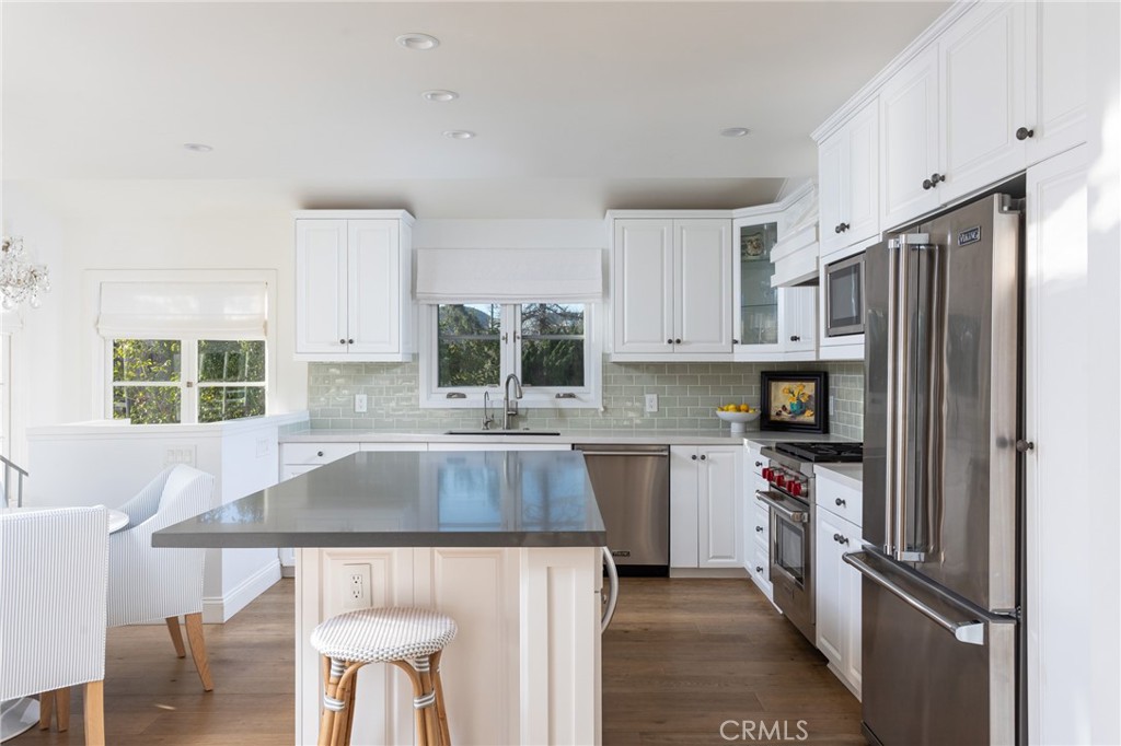 865 Fen Way Laguna Beach, CA 92651 - Photo 6 of 27 a kitchen with kitchen island a sink stove and refrigerator