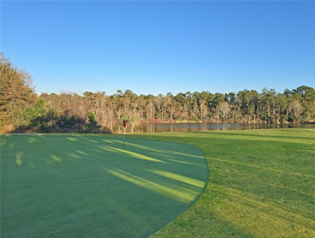 680 Midway Drive, Unit A Ocala, FL 34472 - Photo 32 of 39 a view of a golf course with a lake