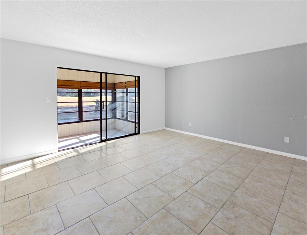680 Midway Drive, Unit A Ocala, FL 34472 - Photo 5 of 39 a view of an empty room with a window
