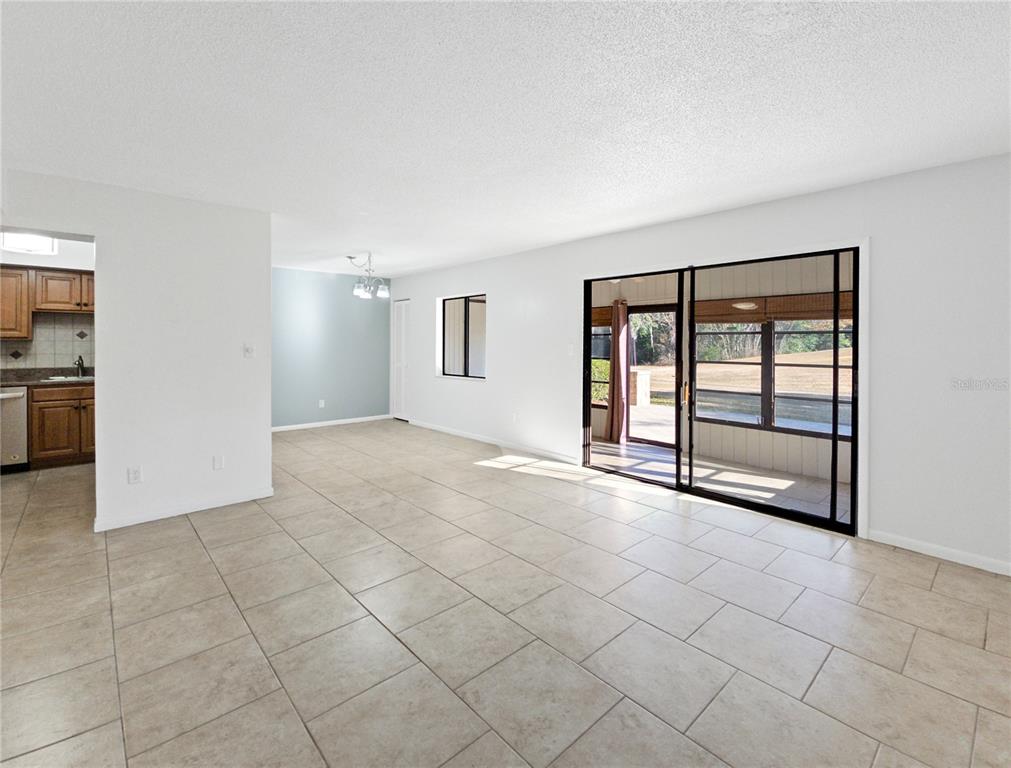 680 Midway Drive, Unit A Ocala, FL 34472 - Photo 6 of 39 a view of an empty room with a window