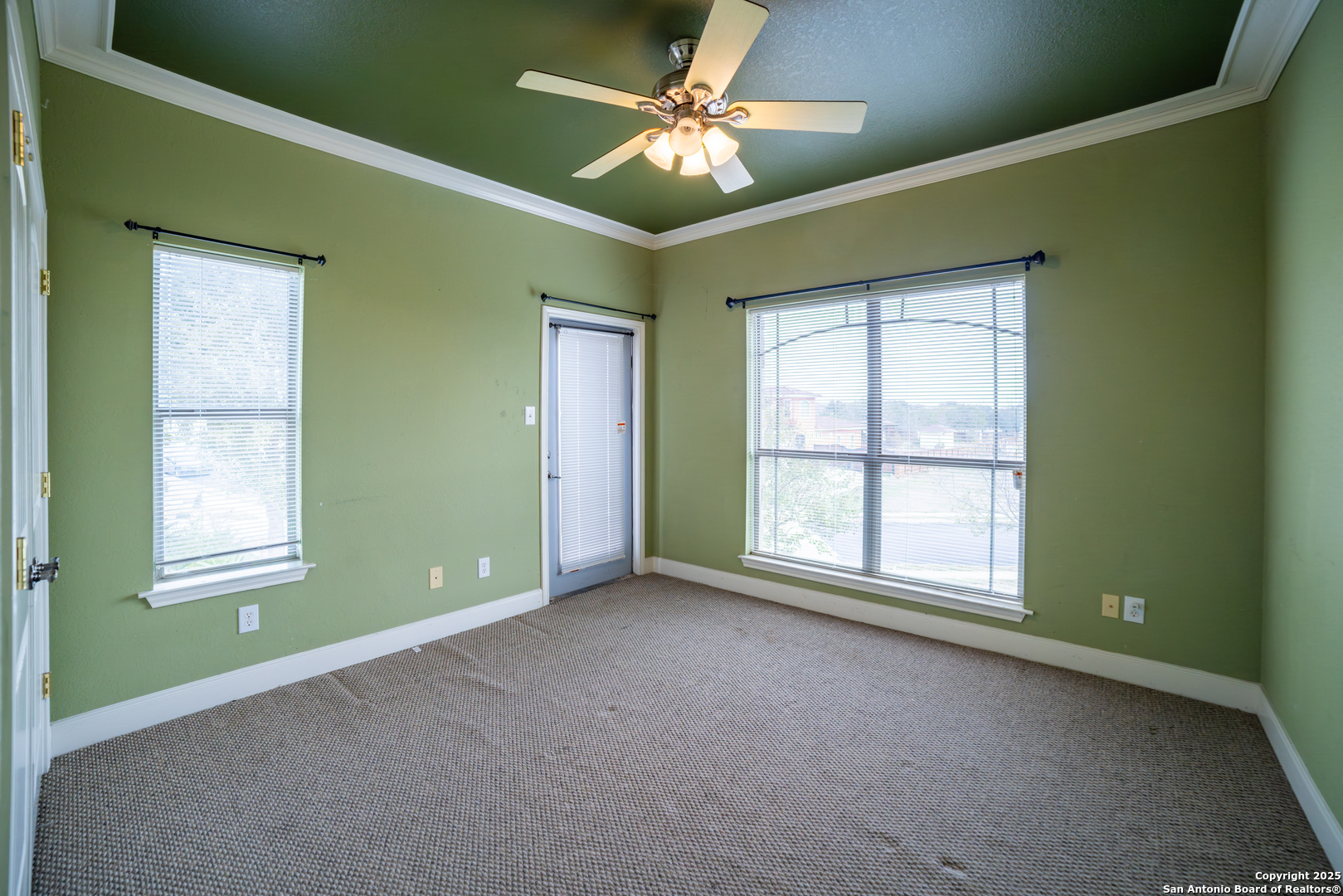 12219 Course View Drive San Antonio, TX 78221 - Photo 11 of 29 an empty room with a ceiling fan and a window