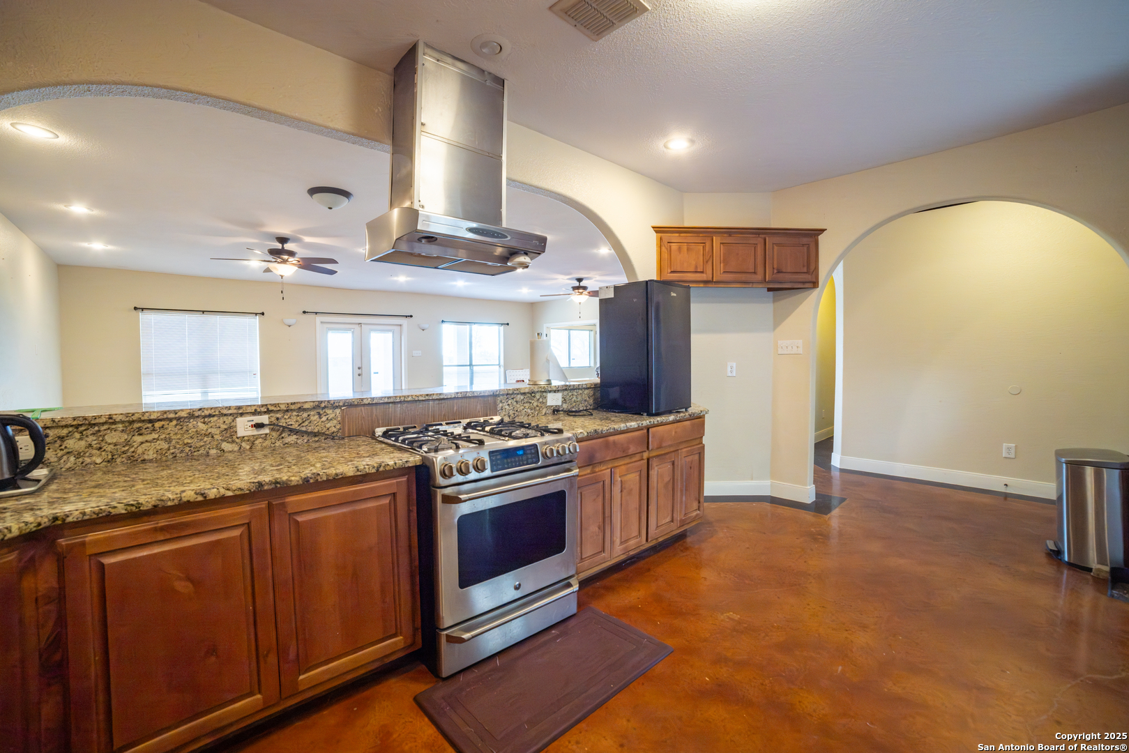 12219 Course View Drive San Antonio, TX 78221 - Photo 4 of 29 a kitchen with stainless steel appliances granite countertop a stove a sink and a refrigerator