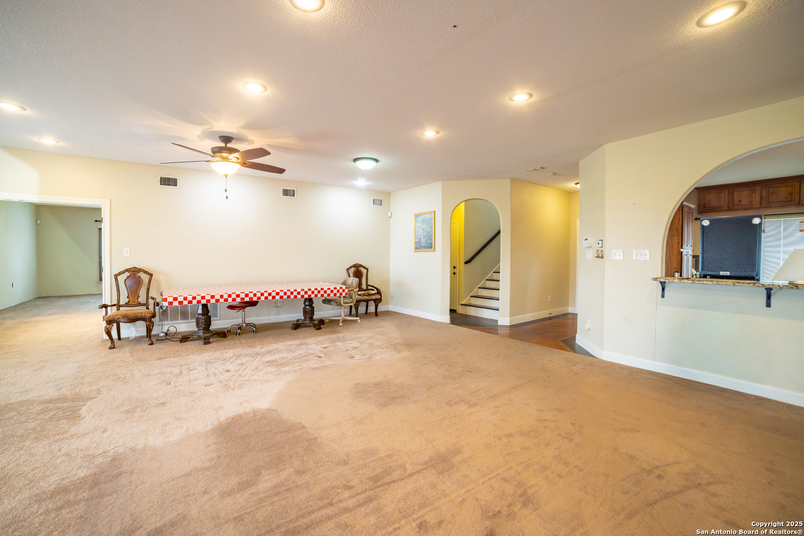 12219 Course View Drive San Antonio, TX 78221 - Photo 6 of 29 a view of a room with gym equipment and a chandelier