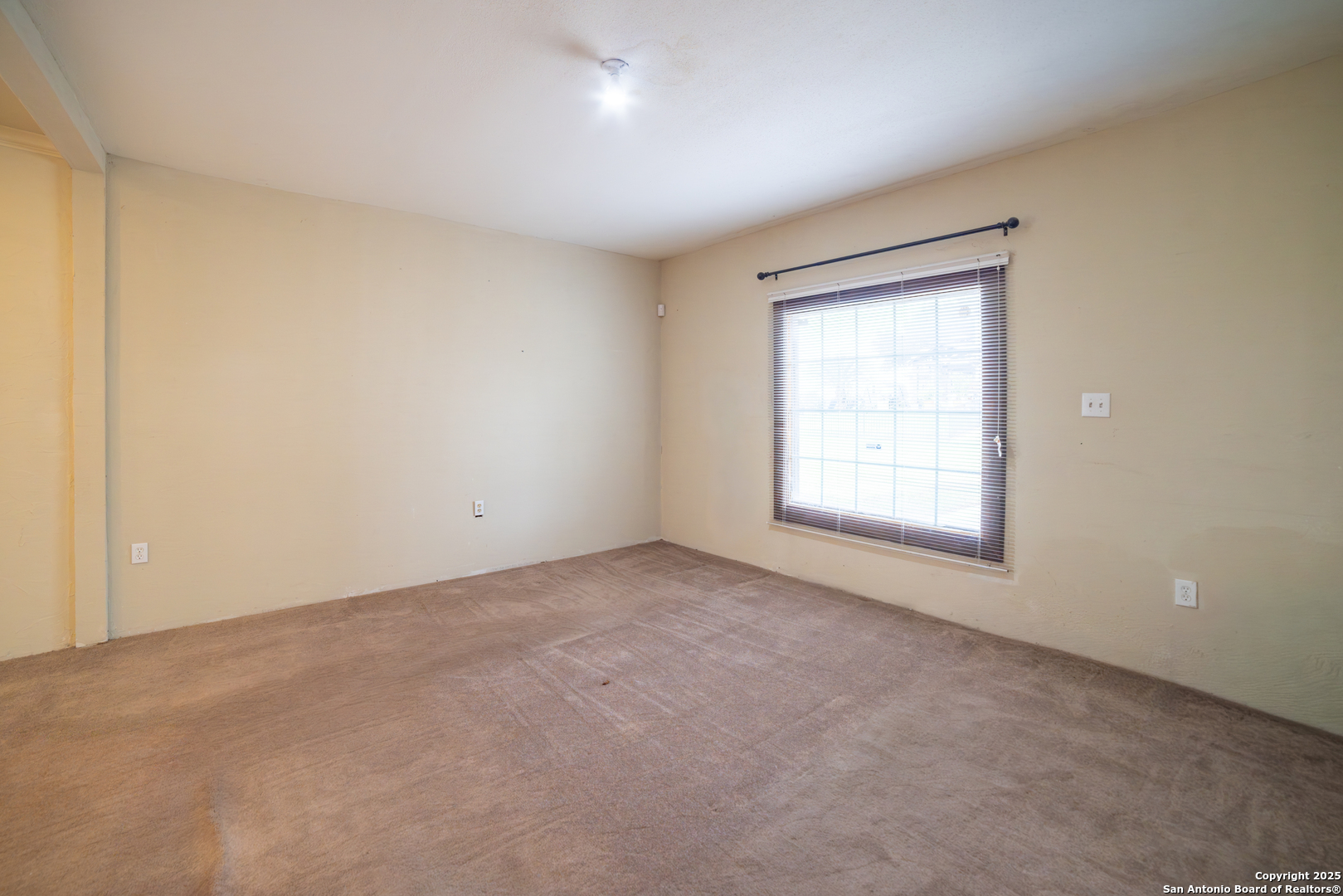 12219 Course View Drive San Antonio, TX 78221 - Photo 7 of 29 an empty room with windows
