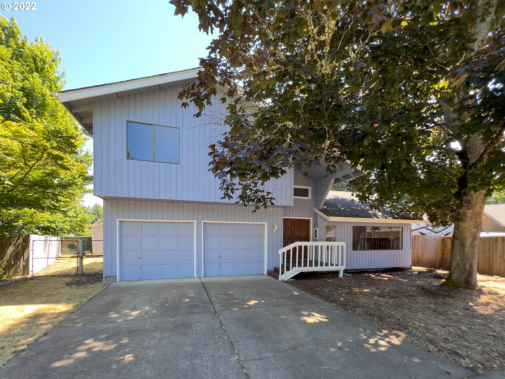 635 71st Street Springfield, OR 97478 - Photo 1 of 31 a front view of a house with a yard and garage