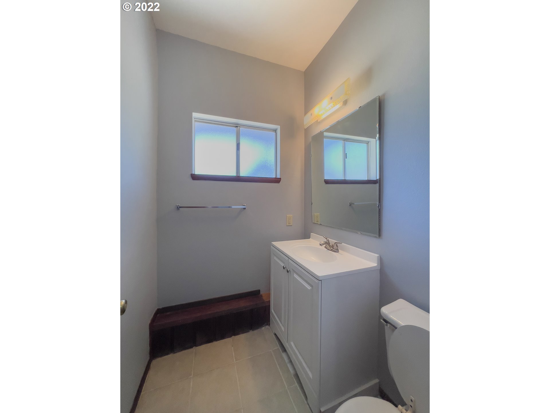 635 71st Street Springfield, OR 97478 - Photo 11 of 31 a bathroom with a sink toilet and vanity