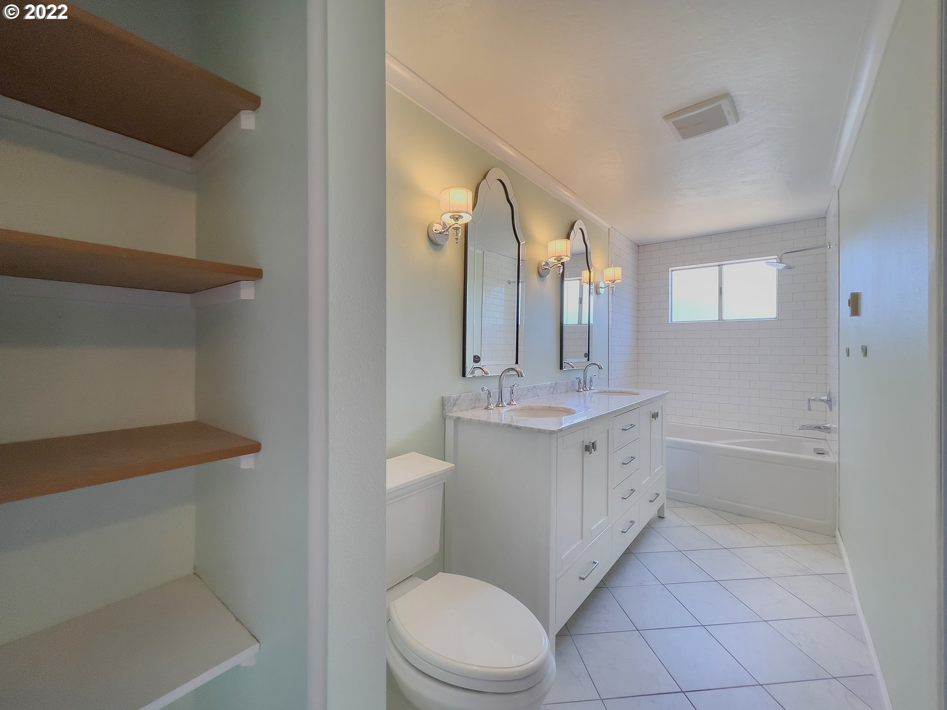 635 71st Street Springfield, OR 97478 - Photo 15 of 31 a bathroom with a double vanity sink toilet mirror and bathtub