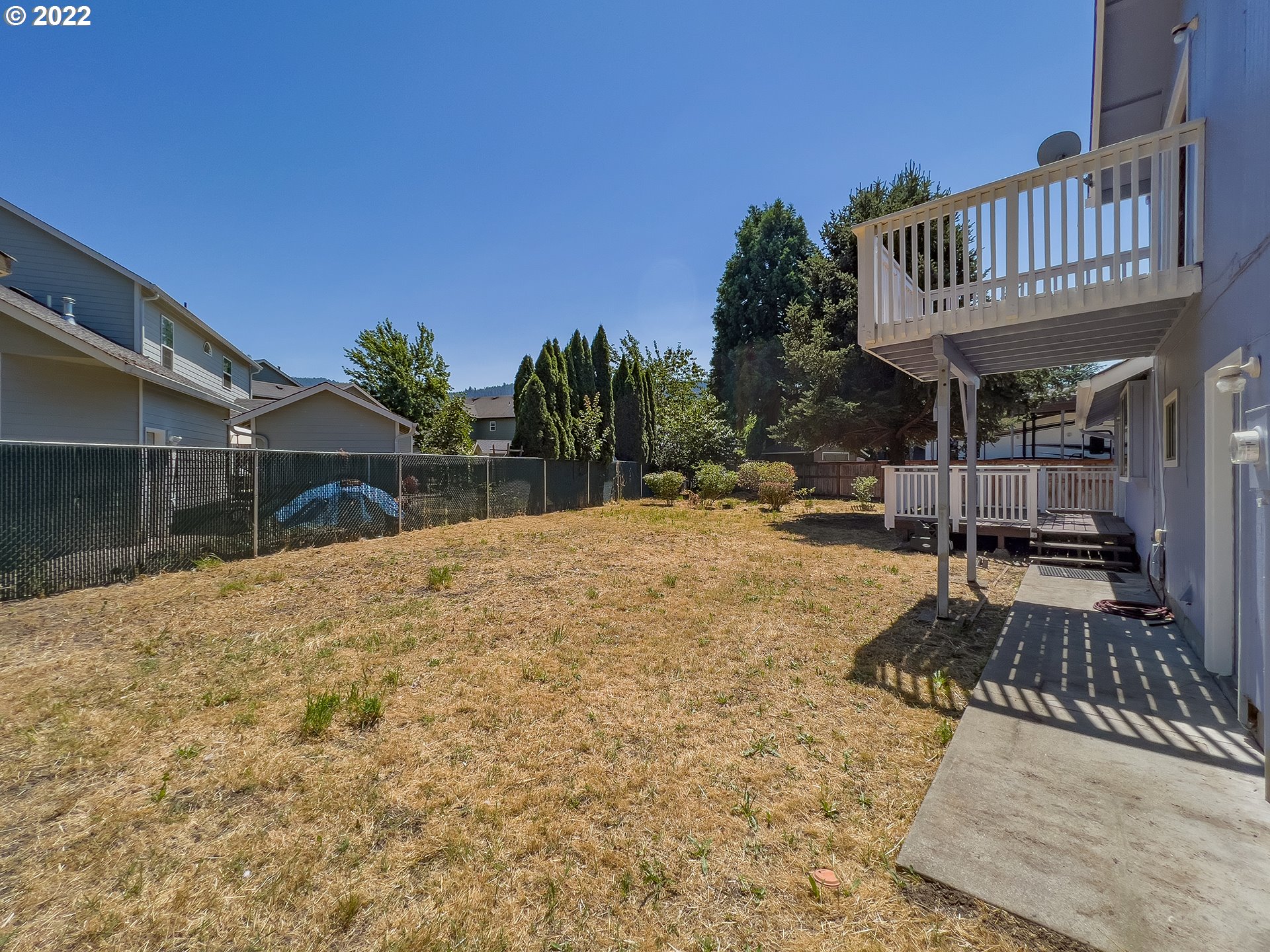 635 71st Street Springfield, OR 97478 - Photo 29 of 31 a view of a house with backyard and sitting area