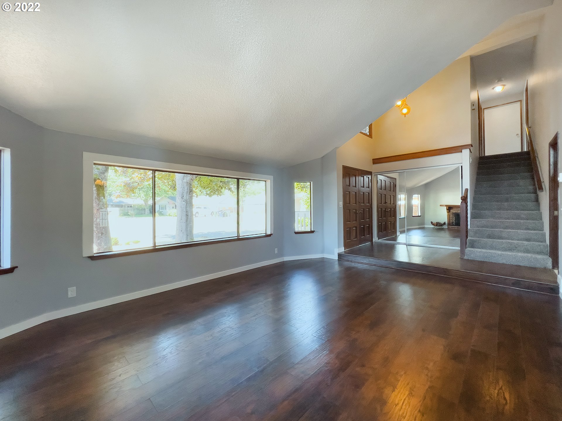 635 71st Street Springfield, OR 97478 - Photo 6 of 31 a view of empty room with wooden floor and fan
