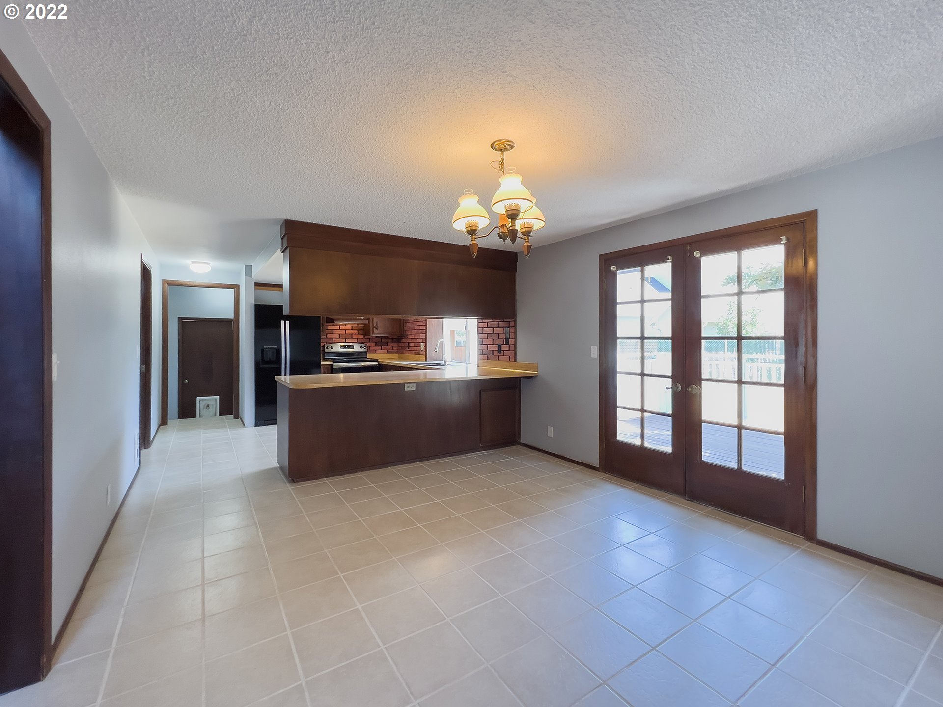 635 71st Street Springfield, OR 97478 - Photo 10 of 31 a room with a chandelier and kitchen view