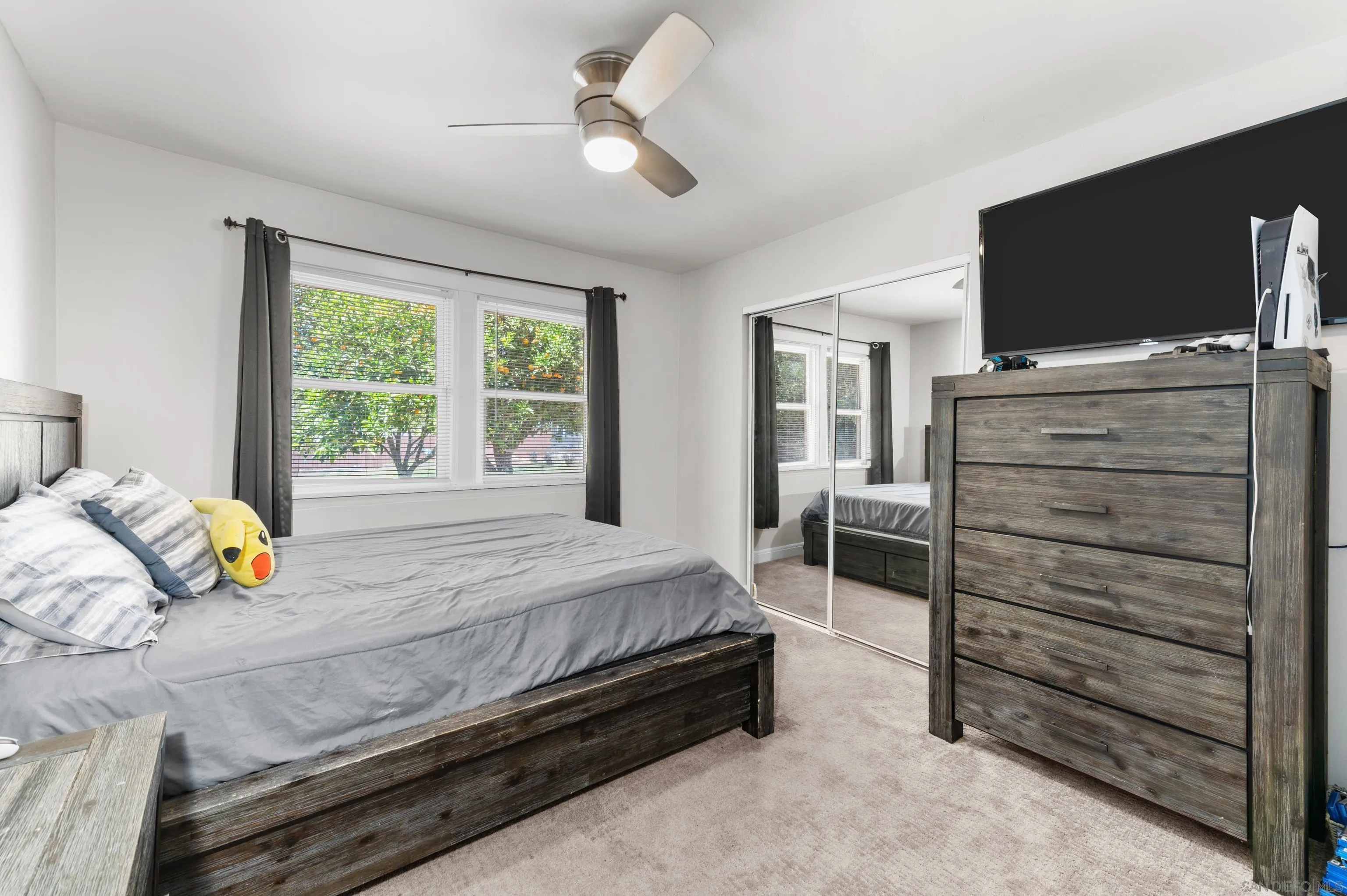 2950 Olive View Road Alpine, CA 91901 - Photo 13 of 29 a bedroom with a bed and a flat tv screen on dresser