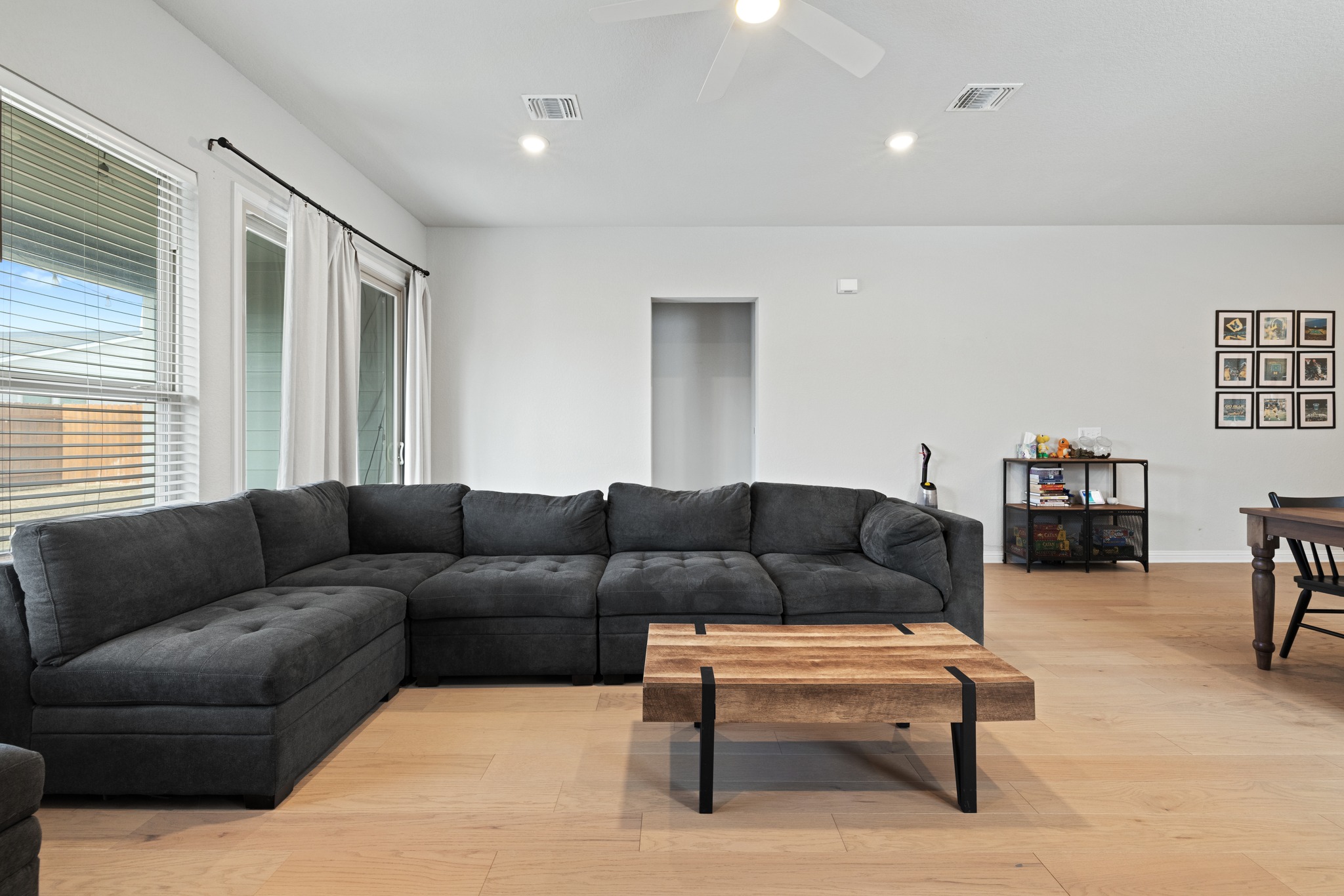 8405 Hubble Walk Austin, TX 78744 - Photo 13 of 36 Living area featuring a ceiling fan, light wood-type flooring, and recessed lighting