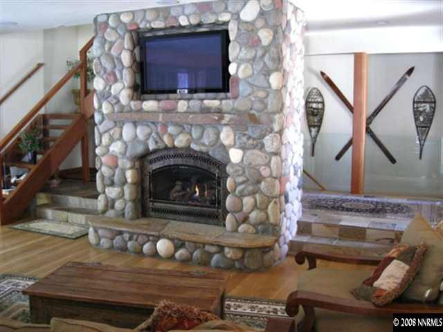 161 Chimney Rock Road Stateline, NV 89449 - Photo 3 of 6 a living room with furniture and a fireplace