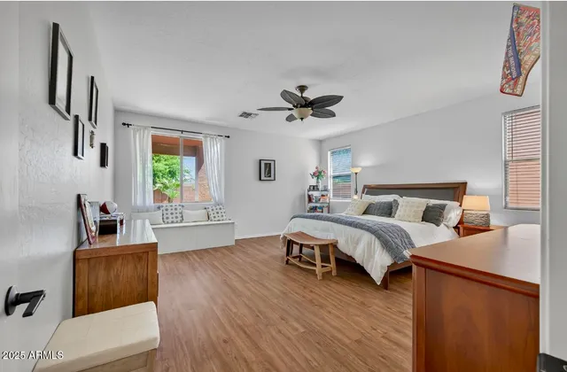 a spacious bedroom with a bed and a couch