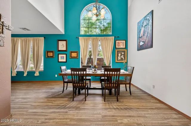 a view of a dining room with furniture window and wooden floor