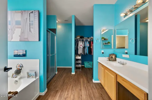 a bathroom with a sink and a large mirror