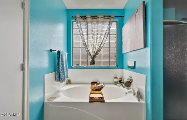 a bathroom with a sink and a window