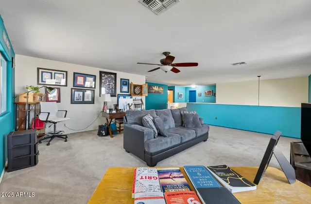 a living room with furniture and a rug