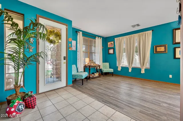 a view of an entryway with wooden floor and a window