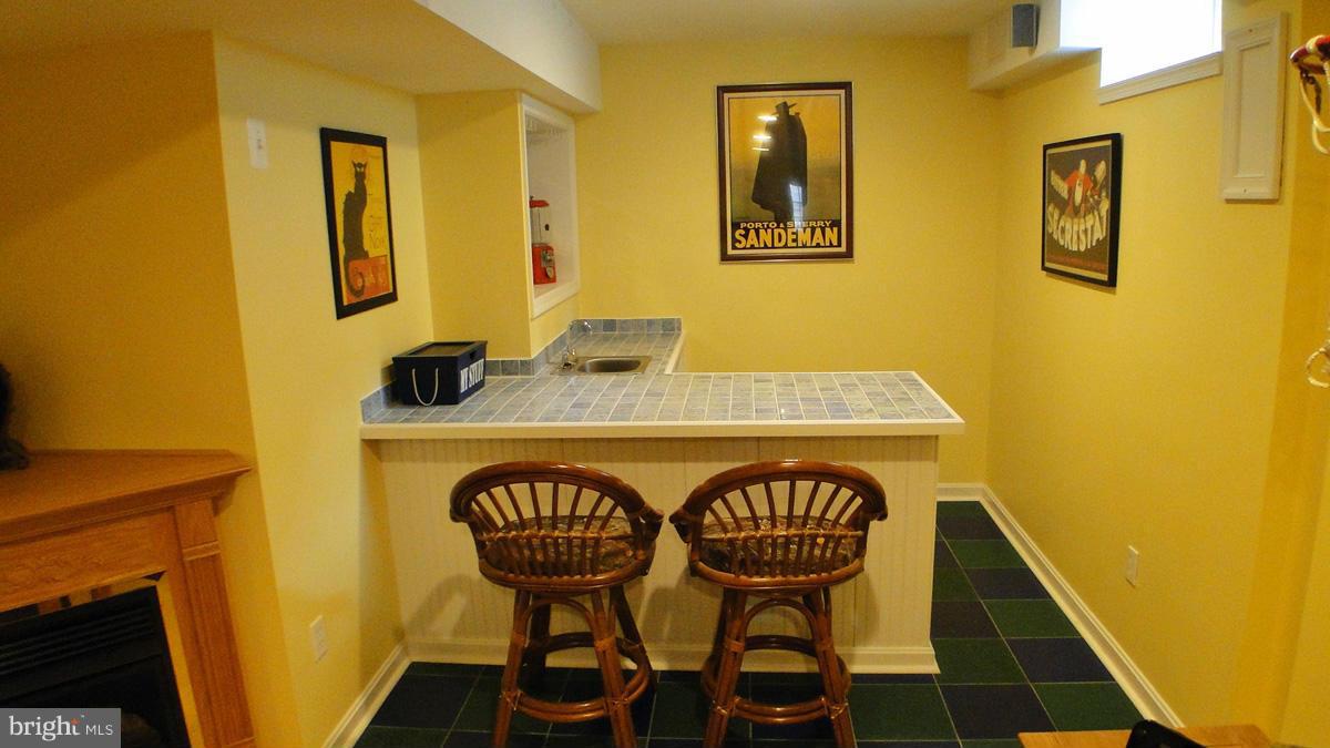 7671 Swallow Road Sykesville, MD 21784 - Photo 23 of 30 a view of a dining room with furniture and wooden floor