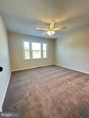 a view of hallway with wooden floor