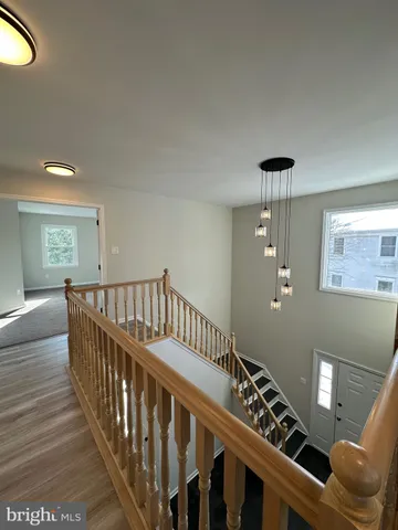 a large kitchen with stainless steel appliances lots of counter space and a sink