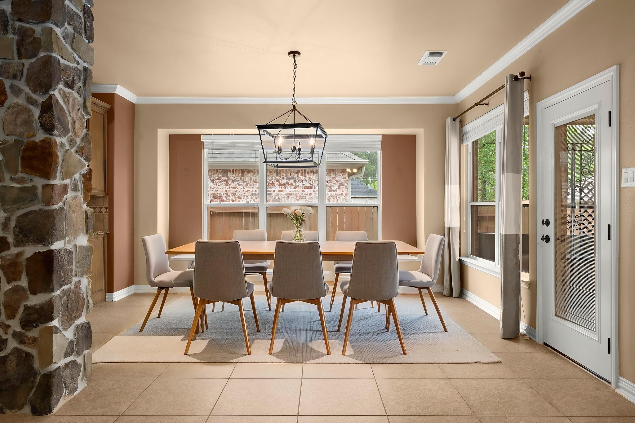 110 David Forest Lane Conroe, TX 77384 - Photo 18 of 35 a view of a dining room with furniture and chandelier
