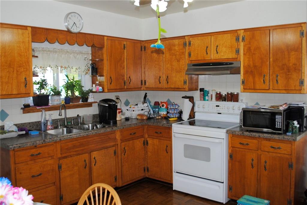 331 Piersol Road Belle Vernon, PA 15012 - Photo 6 of 20 Eat n Kitchen. All Appliances stay. Tile back splash refinished wood cabinets. With Parquet floors