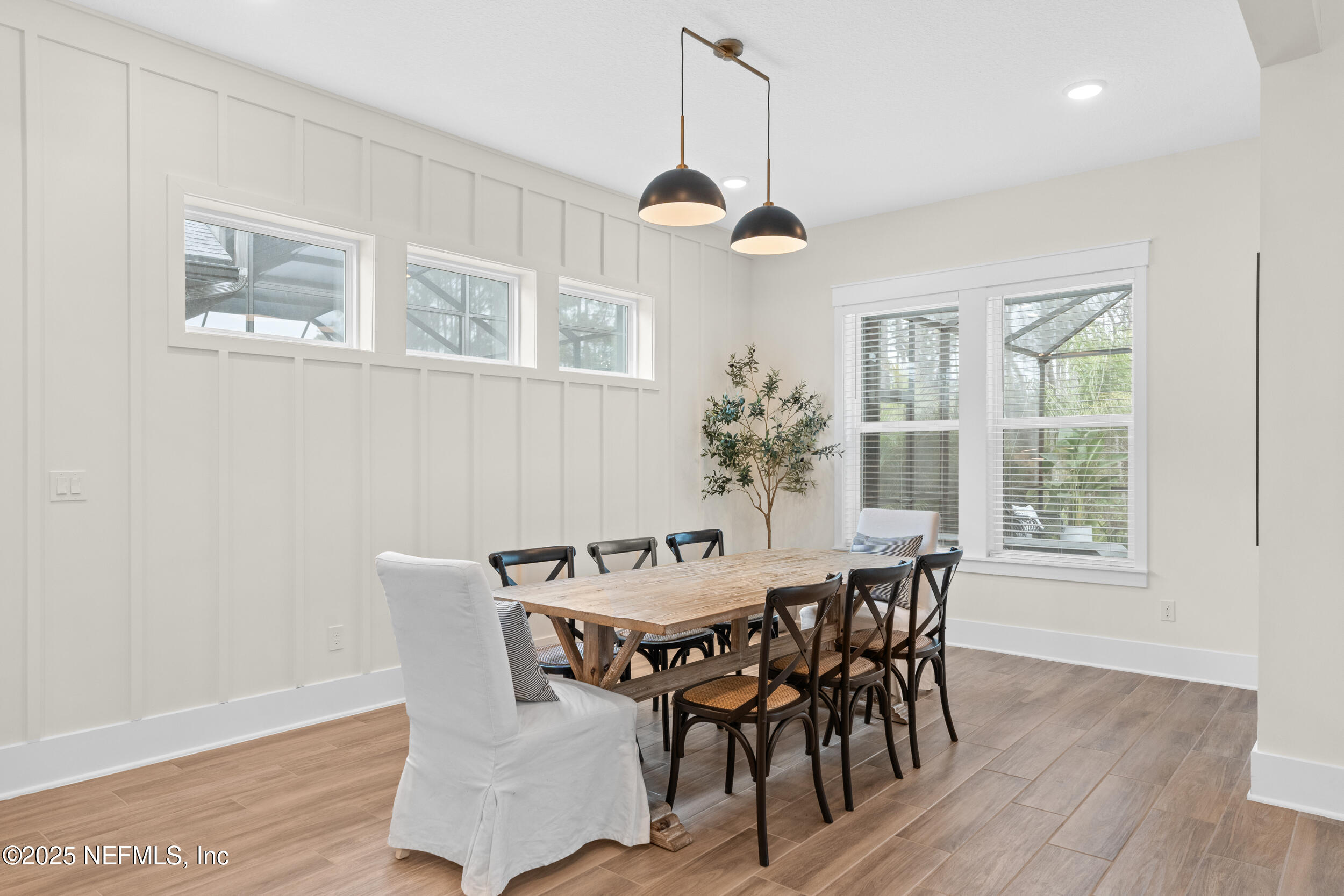 558 Palm Crest Drive Ponte Vedra, FL 32081 - Photo 12 of 83 a dining room with furniture a chandelier and wooden floor