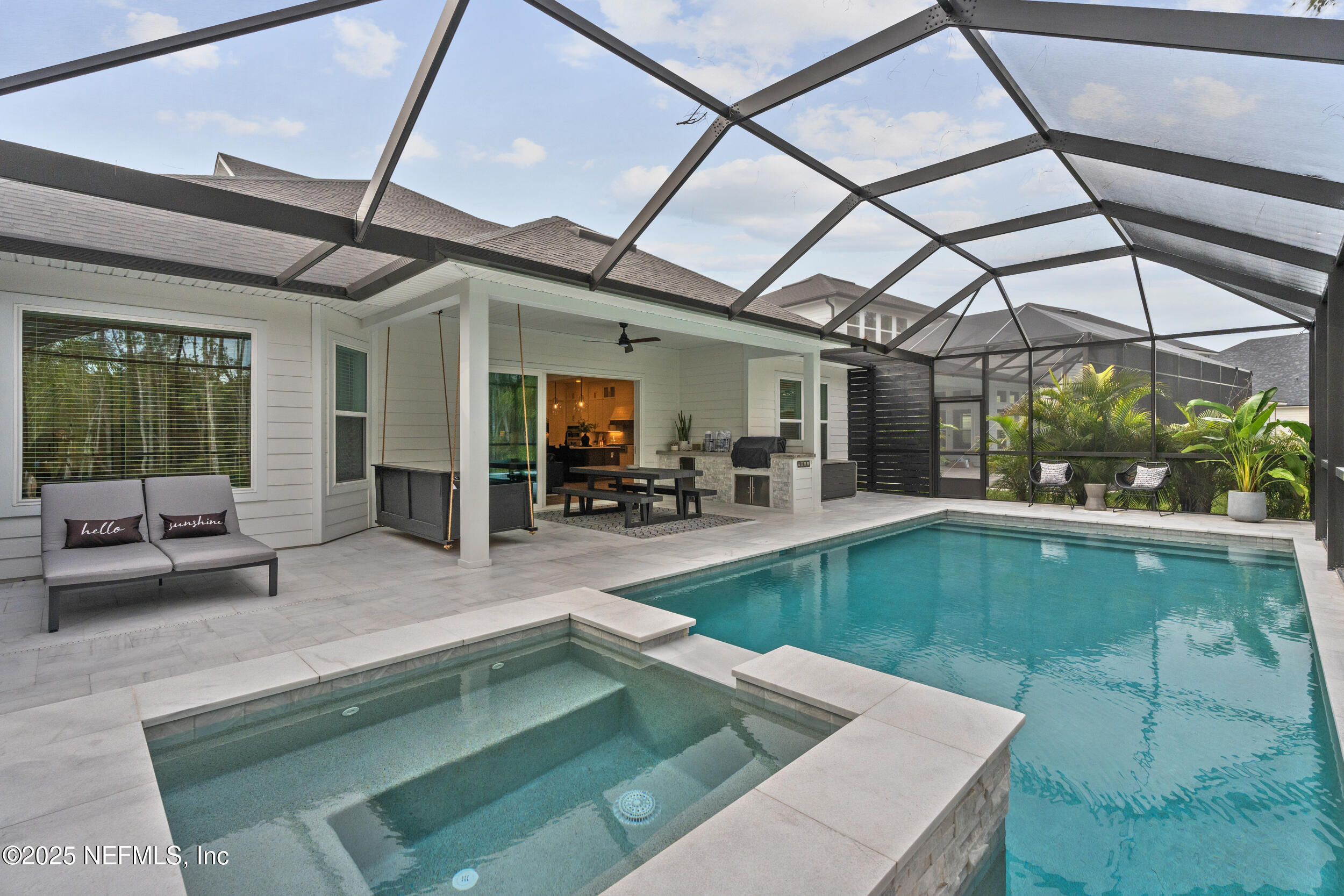 558 Palm Crest Drive Ponte Vedra, FL 32081 - Photo 58 of 83 a indoor swimming pool with outdoor seating and yard
