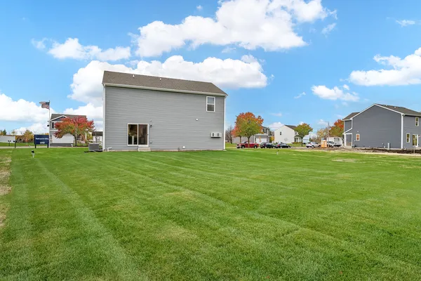 a view of a house with backyard