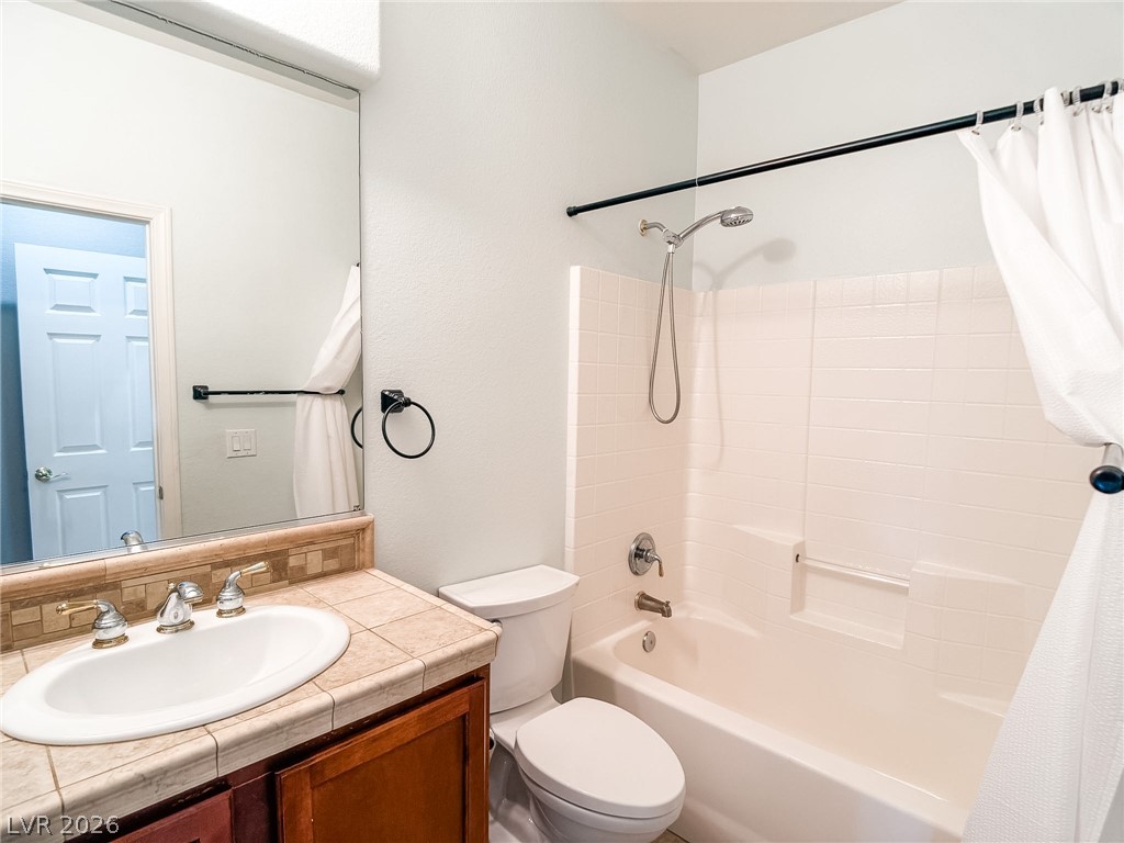 8683 Moreno Mountain Avenue Las Vegas, NV 89178 - Photo 13 of 26 A well-appointed bathroom offers a convenient shower-tub combination and a practical vanity.