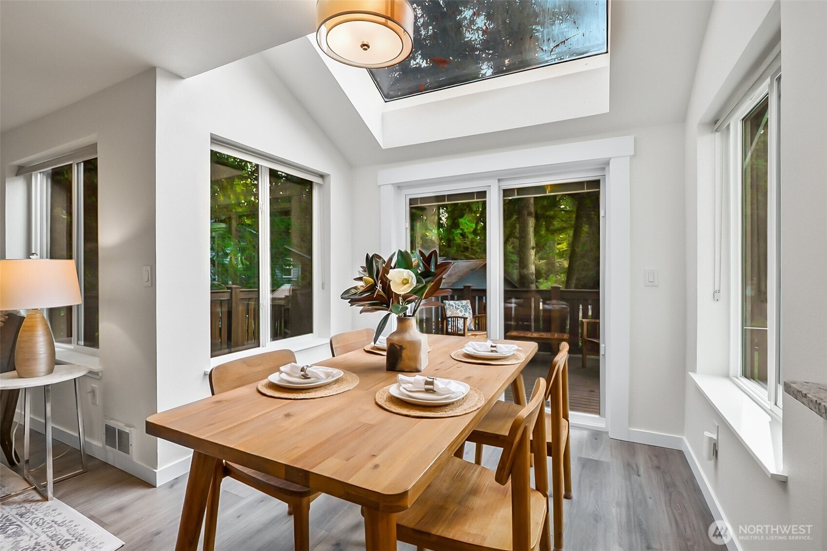 19462 324th Avenue Northeast Duvall, WA 98019 - Photo 12 of 40 a view of a dining room with furniture window and wooden floor