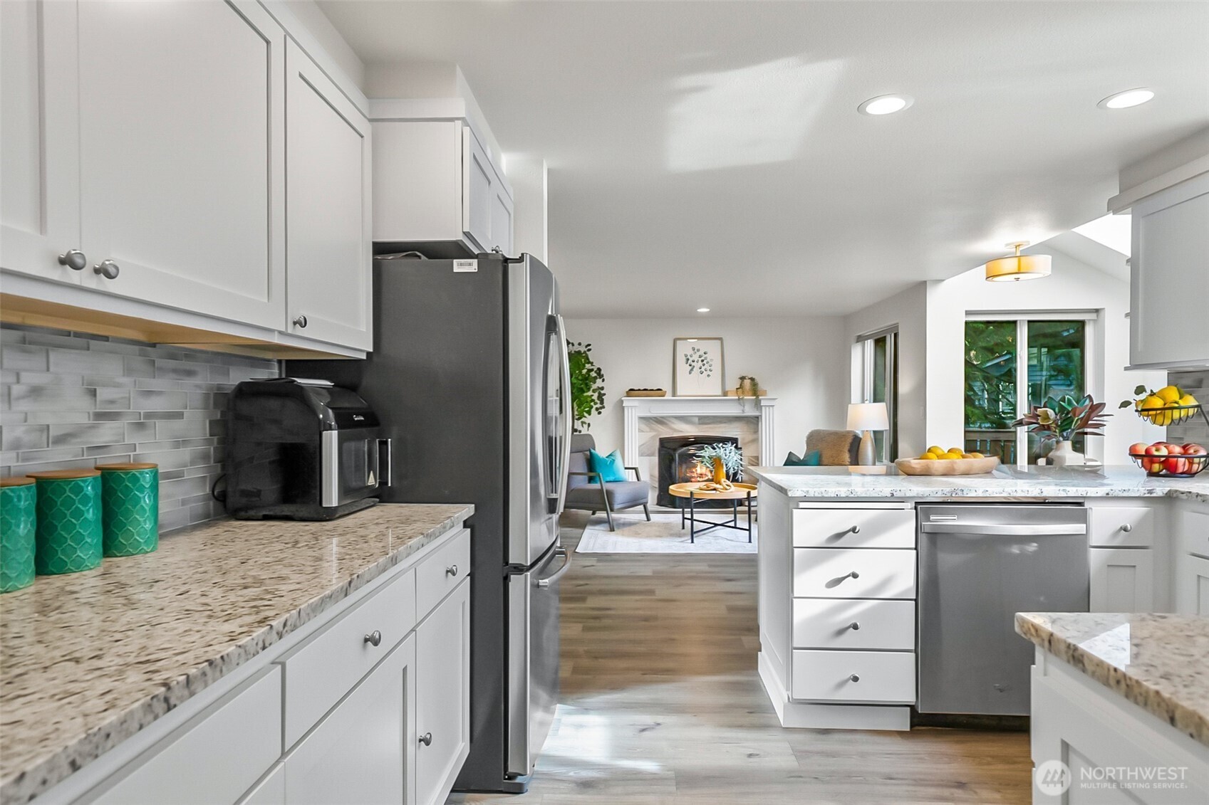 19462 324th Avenue Northeast Duvall, WA 98019 - Photo 16 of 40 a kitchen with stainless steel appliances granite countertop a refrigerator sink and cabinets