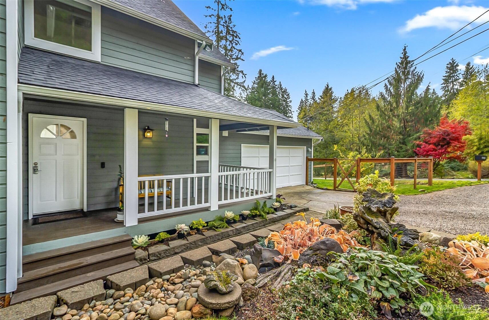 19462 324th Avenue Northeast Duvall, WA 98019 - Photo 2 of 40 a front view of a house with a garden